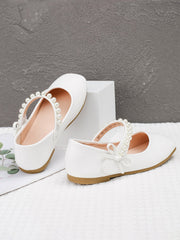 Chaussures en cuir à semelle souple blanches avec boucle perle